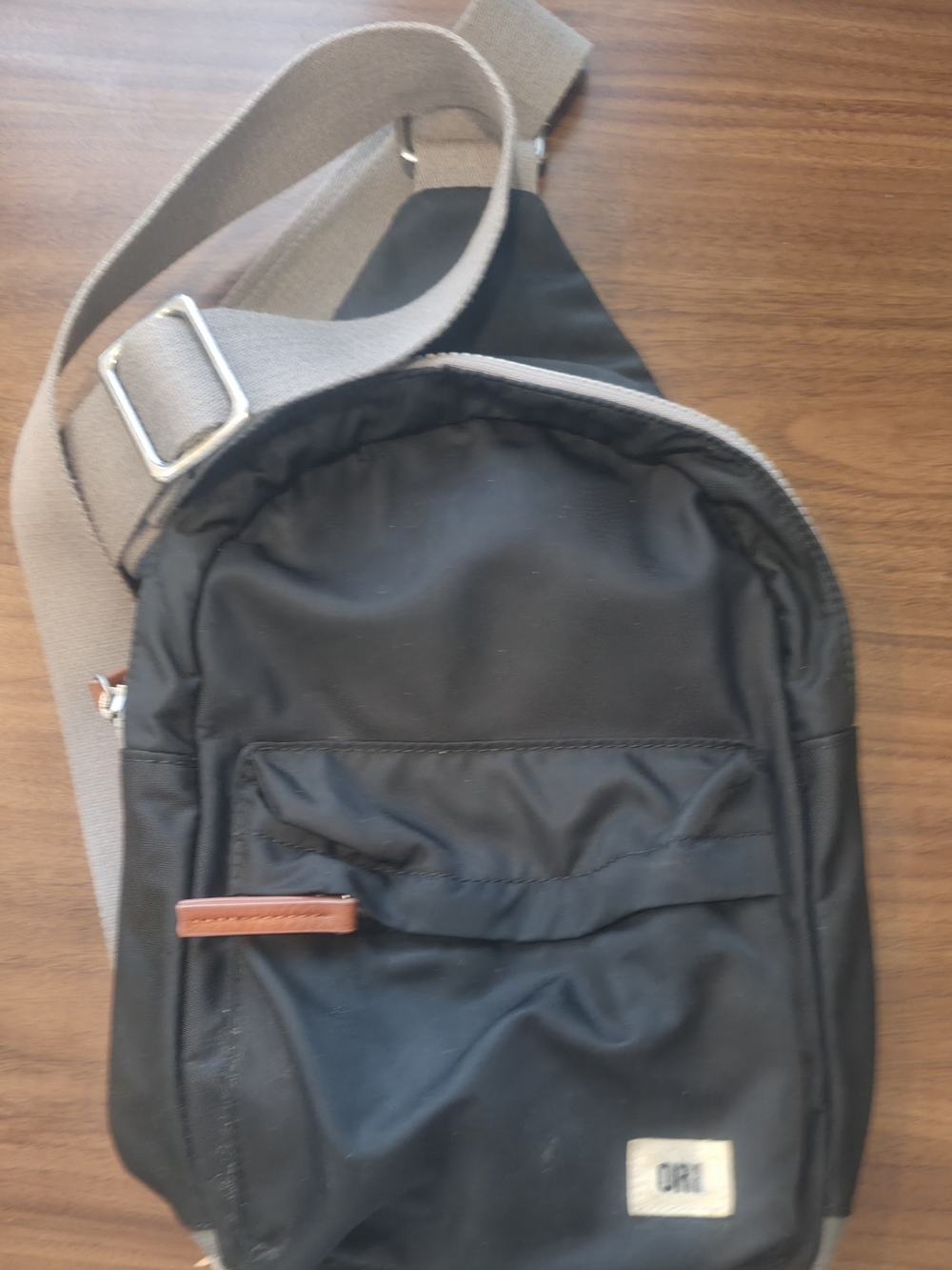 Black Crossbody Sling Bag with Tan Strap